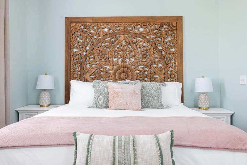 Beautiful headboard with intricately detailed woodwork.