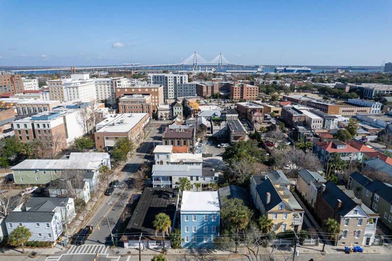 Downtown aerial view of The Palms of Charleston with the Ravenel Bridge in the background.