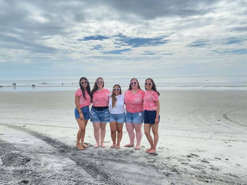The bride to be with her friends on the beach in Charleston.